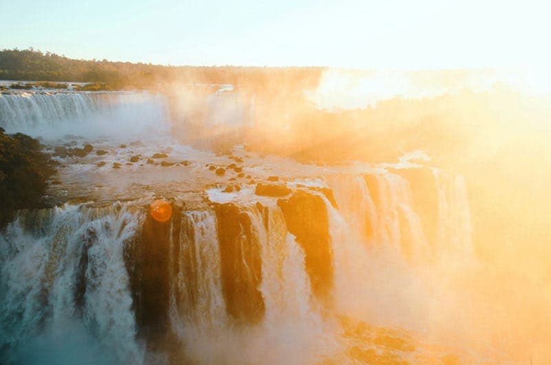 Iguazu Falls in Brazil in golden light, highlighting dramatic natural scenery during a school exchange in Brazil.