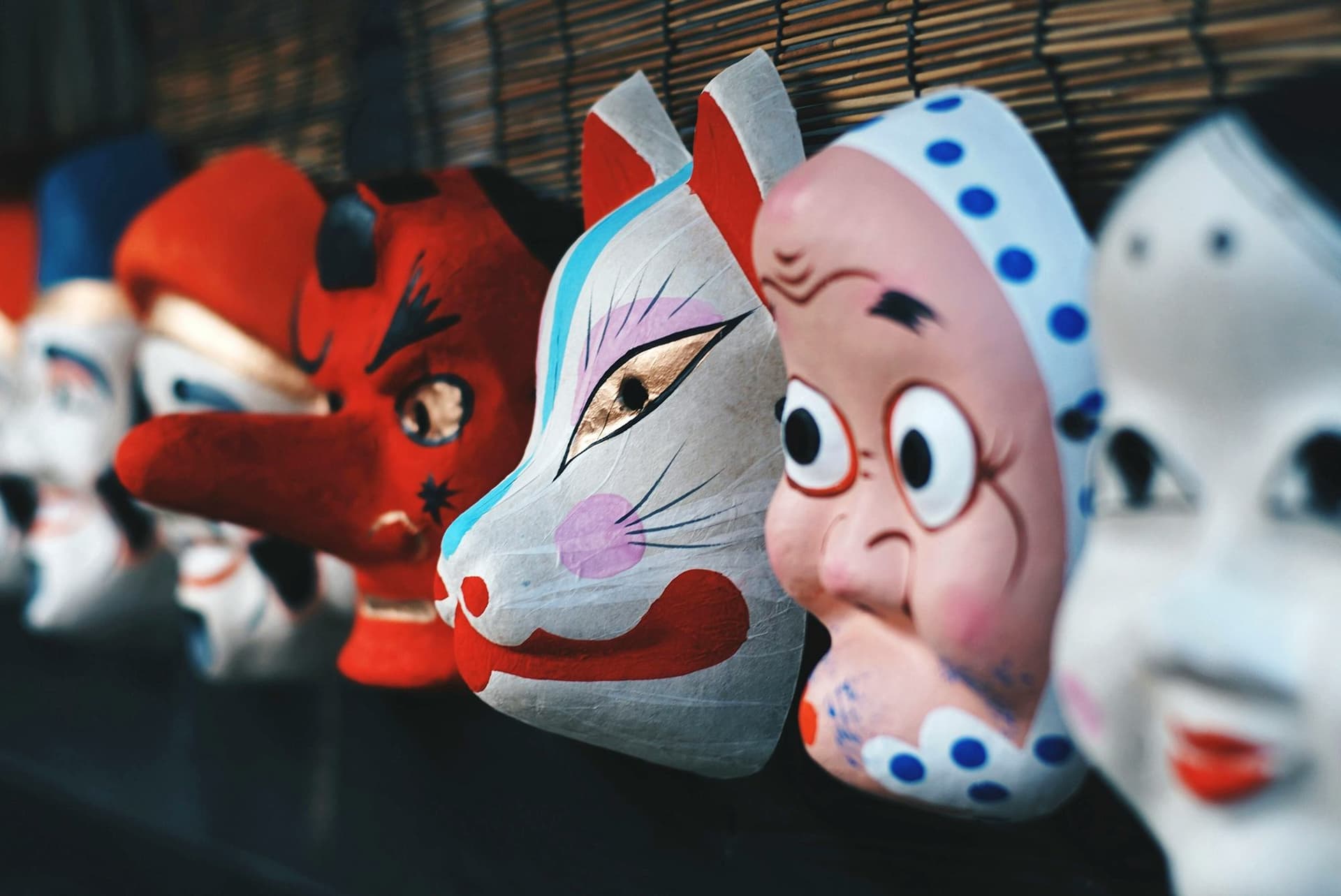 Traditional Japanese masks explored during a high school programme in Japan, connecting school life and local culture.