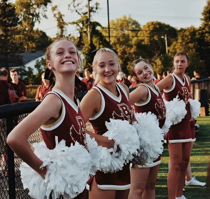 Group of cheerleaders during a school sports event at a high school in the USA.