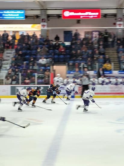 Students playing ice hockey in a Canadian arena, showing competitive school sport during a study programme in Canada.