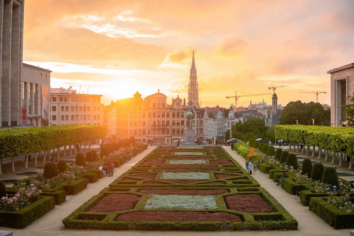 Panoramic view of the gardens of Brussels at sunset, with the city’s architecture in the background during their study year abroad.
