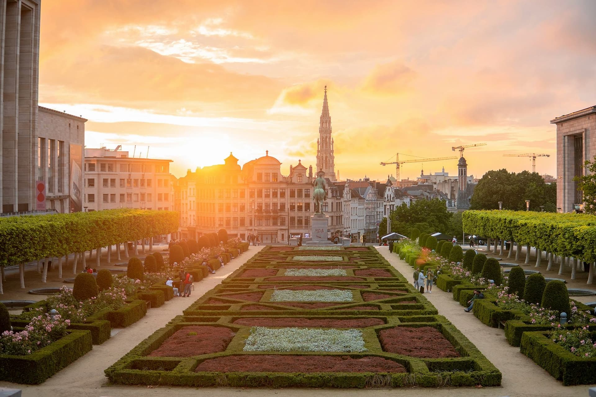 Panoramic view of the gardens of Brussels at sunset, with the city’s architecture in the background during their study year abroad.