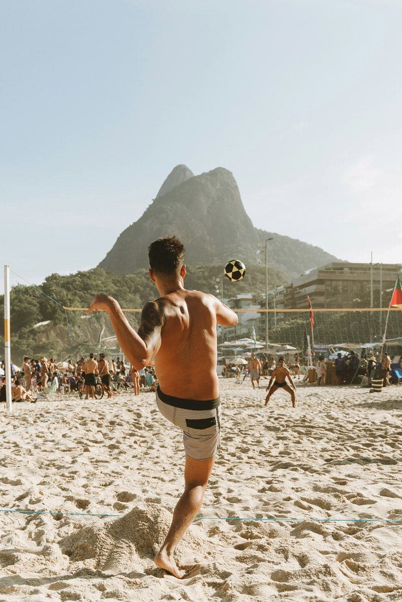 Student playing beach sports in Brazil, showing an active lifestyle during a school exchange in Brazil.