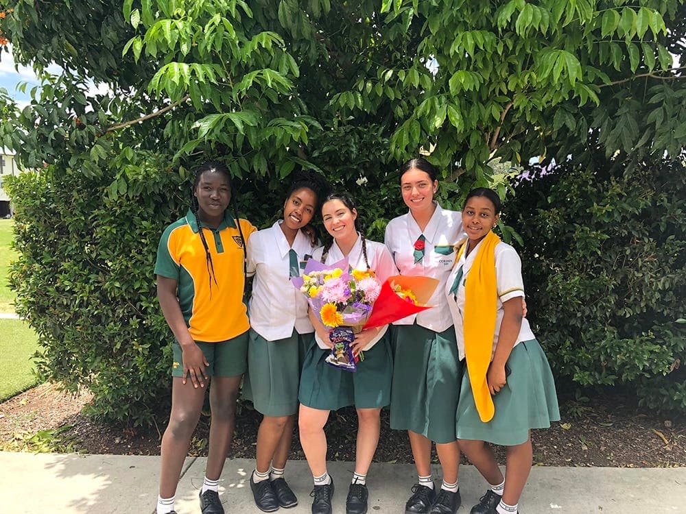 Students in uniform celebrate together during school life abroad in Australia, building friendships through daily school routines.