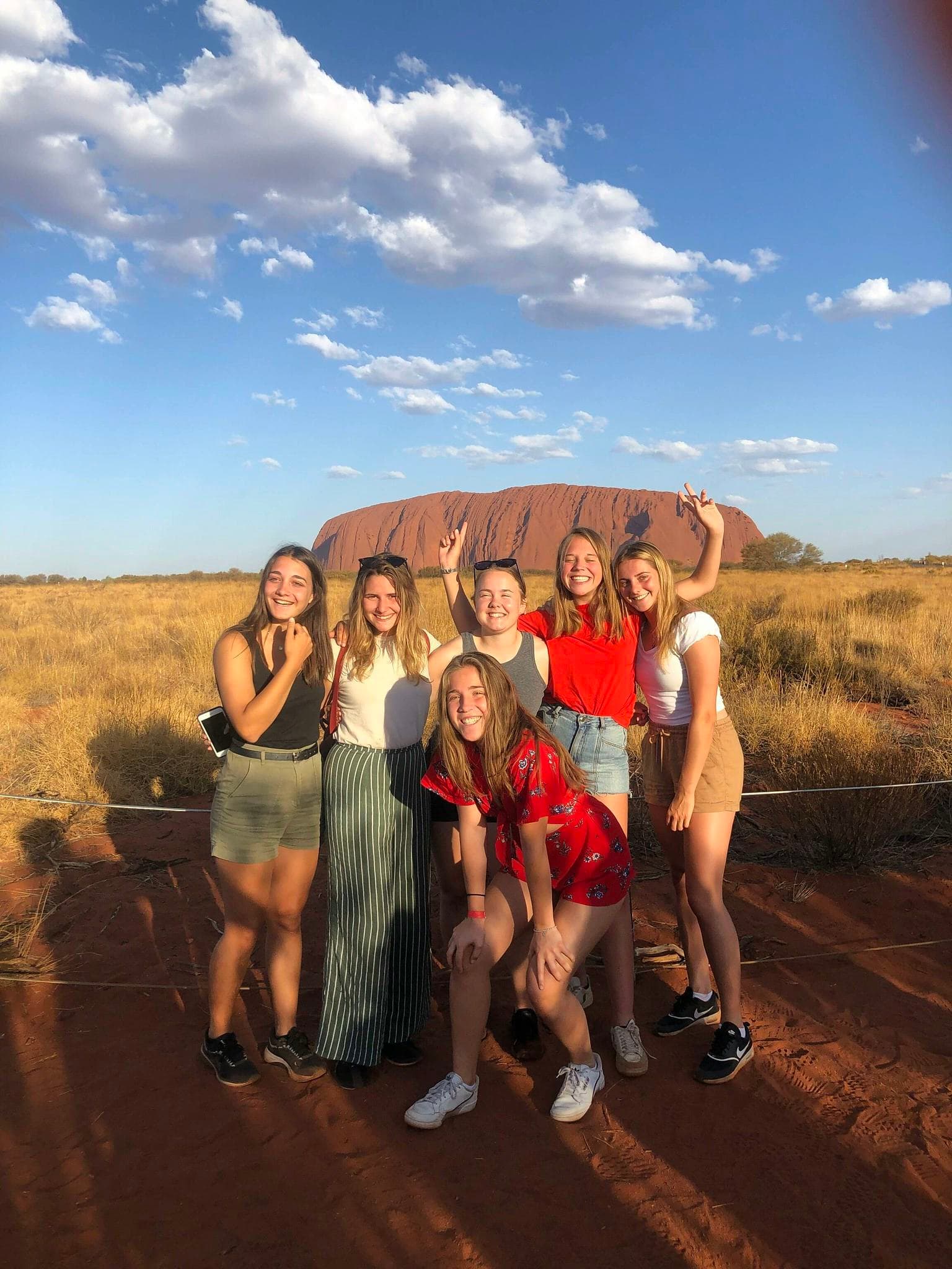 Students visiting Uluru during a school programme in Australia.