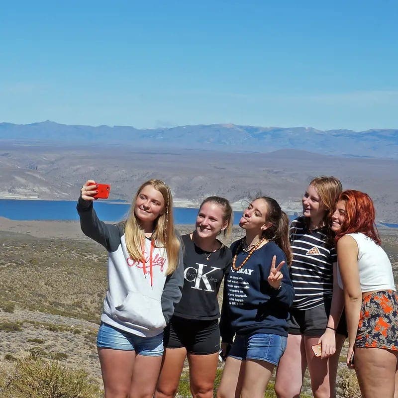 Group of students taking a selfie in an Argentine landscape during a shared school programme experience in Argentina.