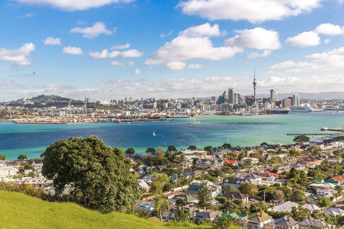 Panoramic view of Auckland with harbour and skyline, representing a school year in New Zealand balancing city life and nature.