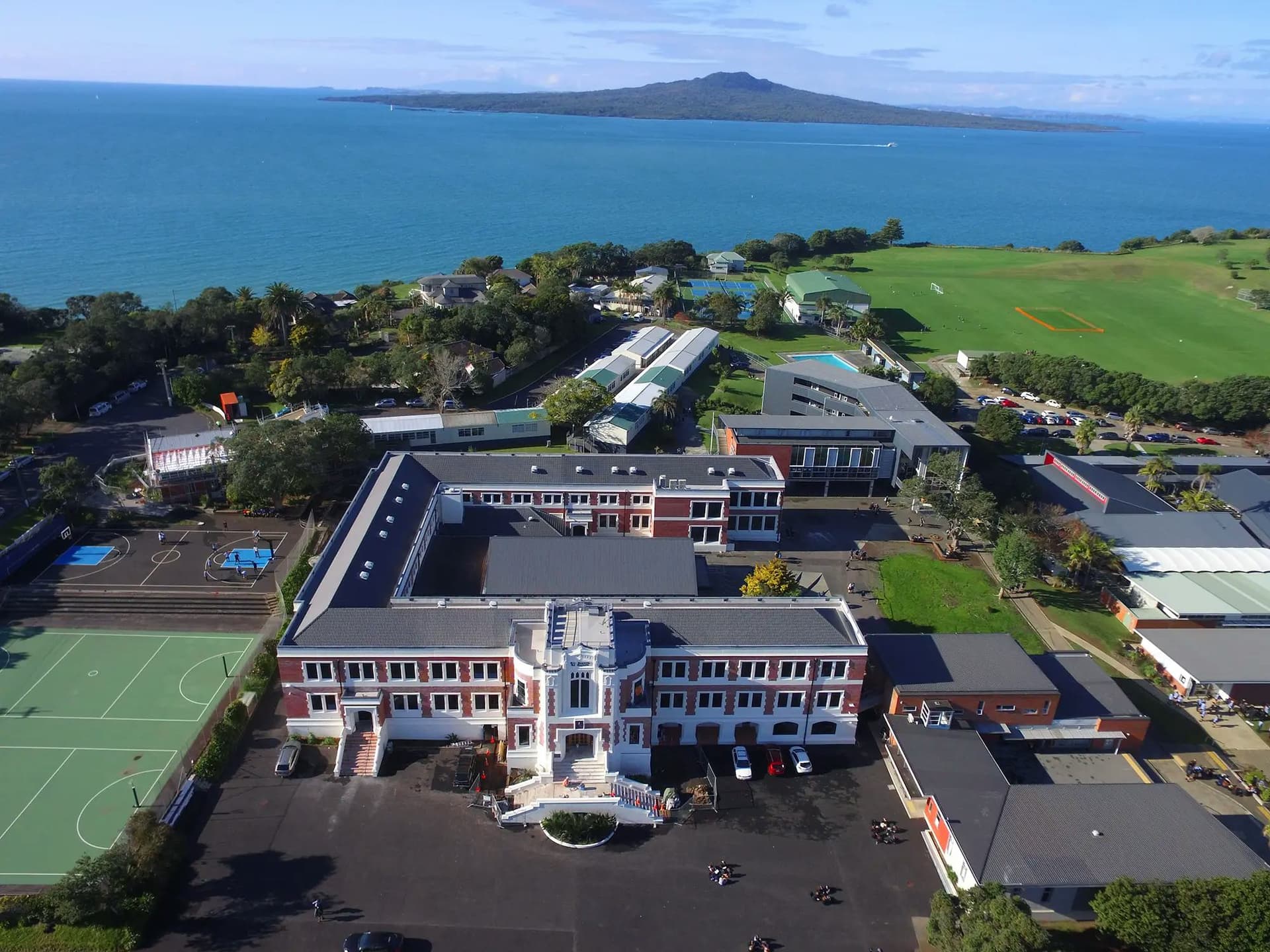 Aerial view of Takapuna Grammar School campus during a school exchange year in New Zealand, featuring school buildings and sports areas.