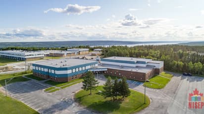 Aerial view of a modern school campus in Canada during a school programme.