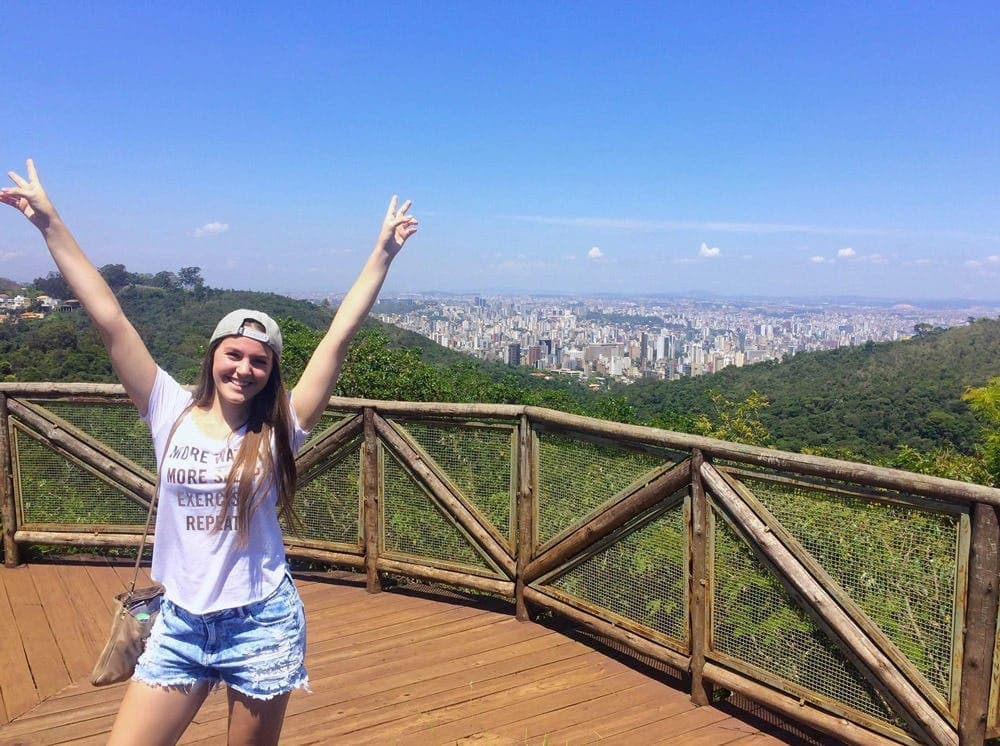 Student at a viewpoint in Brazil overlooking the city, showing urban discovery during a school exchange in Brazil.